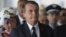 Brazil's President Jair Bolsonaro arrives for the inauguration ceremony of his new naval commander, Ilques Barbosa Junior, at the Naval Club in Brasilia, Jan. 9, 2019. 
