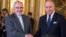 FILE - French foreign minister Laurent Fabius, right, poses for photographers with his Iranian counterpart Jawad Zarif prior to their meeting at the Quai d'Orsay in Paris, France, Nov. 5, 2013. 