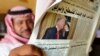 A man holds the daily Asharq Al-Awsat newspaper fronted by a picture of U.S.President Donald Trump, at a coffee shop in Jiddah, Saudi Arabia, Jan. 29, 2020, following Trump's unveiling of a Mideast peace plan. 