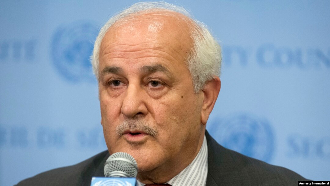 FILE - Palestinian Ambassador Riyad Mansour speaks at U.N. headquarters, July 28, 2014. Mansour on Wednesday accused Israel of continuing to break international law as it builds settlements in occupied territory. 