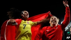 Morocco's Salma Amani, left, and Morocco's Fatima Gharbi celebrate after the Women's World Cup Group H soccer match between Morocco and Colombia in Perth, Australia, Thursday, Aug. 3, 2023.