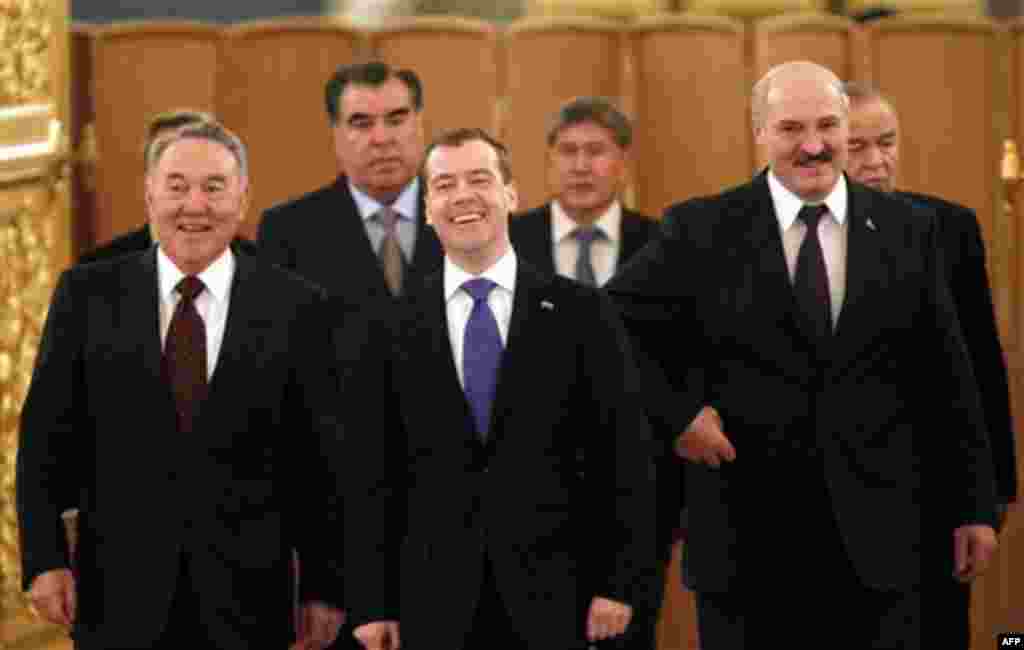 Russian President Dmitry Medvedev, center, Belarusian President Alexander Lukashenko, right, and Kazakh President Nursultan Nazarbayev, left, enter a hall before a summit of the Collective Security Treaty Organization in the Kremlin in Moscow, Tuesday, D