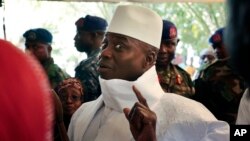 Gambian President Yahya Jammeh gestures before voting in Banjul, Gambia, Dec. 1, 2016. In a reversal, having first conceded defeat in the country's presidential election, he now refuses to accept the poll's result.