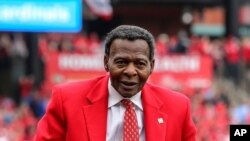 In this April 5, 2019, file photo, former St. Louis Cardinals great Lou Brock rides around the warning track prior to the Cardinals home opener baseball game against the San Diego Padres in St. Louis.