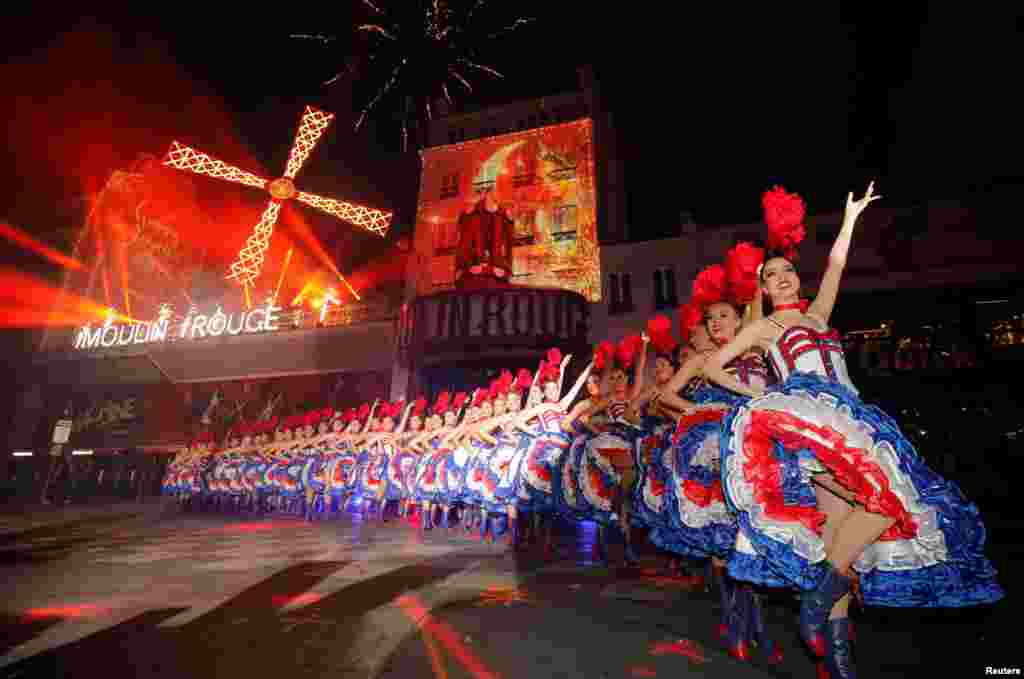 French Cancan dancers perform in front of the Moulin Rouge cabaret to celebrate its 130th anniversary in Paris, France, Oct. 6, 2019.