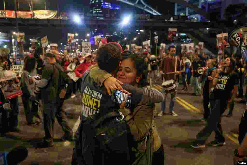 Supporters of Israeli hostages, who were kidnapped during the deadly October 7, 2023 attack by Hamas, react to news on the Gaza ceasefire negotiations, during a protest to demand a deal to bring every hostage home, in Tel Aviv, Israel.