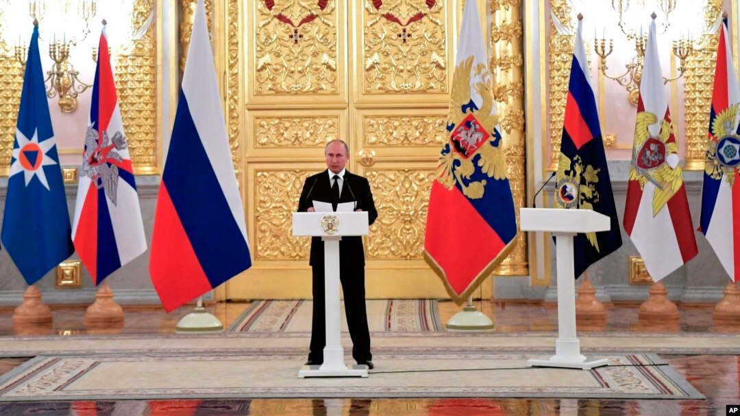 Russian President Vladimir Putin speaks as he meets with top military officers and law enforcement officials in the Kremlin, in Moscow, Russia, Oct. 25, 2018.