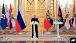 Russian President Vladimir Putin speaks as he meets with top military officers and law enforcement officials in the Kremlin, in Moscow, Russia, Oct. 25, 2018.