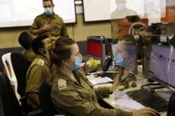 Military personnel at the Israeli Defence Force Corona Task Force Headquarters conduct epidemiological investigations as part of the army's effort to trace chains of infection to curb the spread of the COVID-19 in Ramle, Sept. 17, 2020.