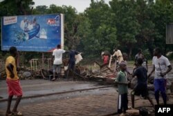 Protesters build barricades to block circulation on the Martyrs Bridge of Bamako, Mali, July 11, 2020.