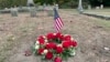 Flowers rest on the grave of Byron R. Johnson, a Union soldier who was born in Pawtucket, Rhode Island, in 1844 and fought in the Civil War, at Oak Grove Cemetery in Pawtucket, Oct. 17, 2024, after his cremated remains were transferred from storage at a cemetery in Seattle.