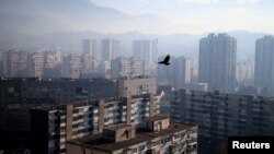 FILE - General view of the city as smog blankets Sarajevo, Bosnia and Herzegovina.