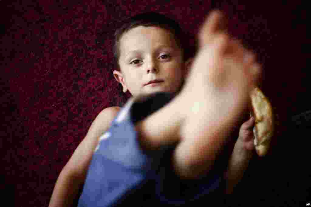 Georgi Pervashvili, 4, moved to the refugee village from Eredvi, South Ossetia. (Yuli Weeks for VOA)