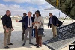 FILE - U.S. Ambassador to the United Nations Linda Thomas-Greenfield is welcomed by U.S. Ambassador to Somalia Larry Andre, center left, on her arrival in Mogadishu, Somalia, Jan. 29, 2023.