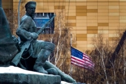 FILE - The U.S. Embassy is seen behind a monument to the Workers of 1905 Revolution in Moscow, Russia, Dec. 30, 2016. In mid-April 2021, Russia announced plans to order 10 U.S. diplomats to leave Russia in a retaliatory response to U.S. sanctions.