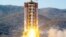 FILE - A North Korean long-range rocket is launched into the air at the Sohae rocket launch site, North Korea, in this photo released by Kyodo, Feb. 7, 2016. 