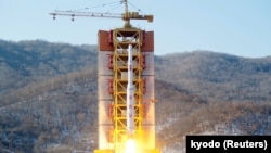 A North Korean long-range rocket is launched into the air at the Sohae rocket launch site, North Korea, in this photo released by Kyodo, Feb. 7, 2016. 