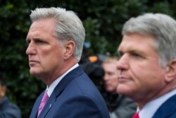 House Minority Leader Kevin McCarthy of California, left, and Rep. Michael McCaul, R-Texas, speak with reporters after a meeting with President Donald Trump at the White House, Oct. 16, 2019, in Washington.