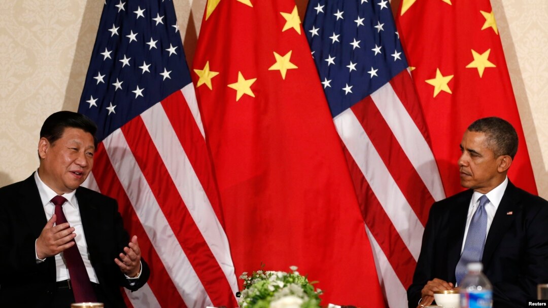 China's President Xi Jinping speaks during his meeting with U.S. President Barack Obama (R), on the sidelines of a nuclear security summit in The Netherlands on March 24 2014.