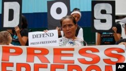 Protesters rally outside the armed forces headquarters to mark World Press Freedom Day which was declared by the UN General Assembly in 1993, May 3, 2019, in Manila, Philippines. 