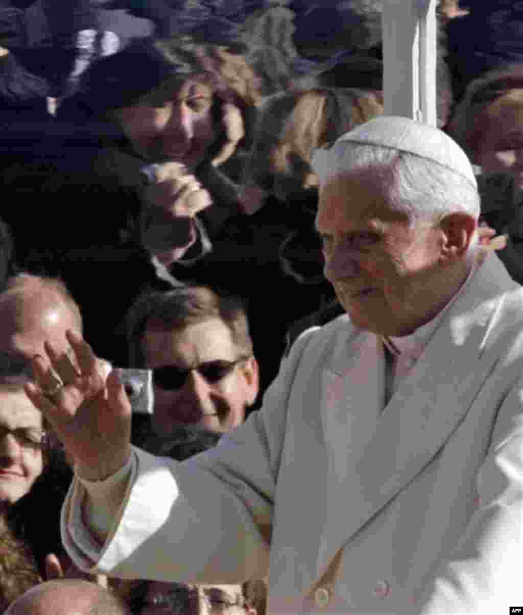 Pope Benedict XVI salutes the faithful as he arrives on his pope-mobile for his weekly general audience, in St. Peter square, at the Vatican, Wednesday, Nov. 17, 2010. (AP Photo/Alessandra Tarantino)