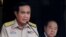 Thailand's Prime Minister Prayuth Chan-ocha speaks during a news conference after his meeting with National Security Council as Deputy Prime Minister and Defense Minister Prawit Wongsuwan looks on at Government House in Bangkok, Aug. 15, 2016. 