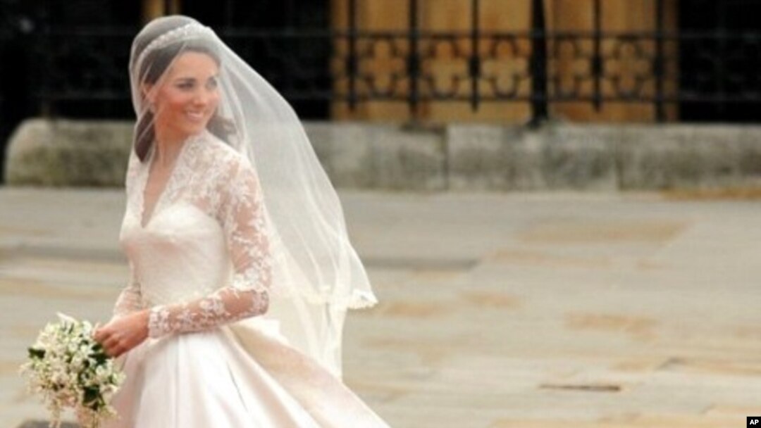 Kate Middleton smiles as she arrives at the West Door of Westminster Abbey in London for her wedding to Britain's Prince William, on April 29, 2011.
