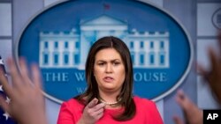 FILE: White House press secretary Sarah Huckabee Sanders calls on a member of the media during the daily press briefing at the White House, Wednesday, July 18, 2018, in Washington. (AP Photo/Andrew Harnik)