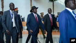 FILE - South Sudan's President Salva Kiir, center, arrives for an African Union summit in Addis Ababa, Ethiopia, Feb. 9, 2020. Speaking Feb. 14 in Juba, Kiir accused summit envoys of trying to prolong South Sudan's dispute over its number of states.