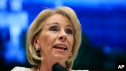 FILE - In this April 10, 2019 photo, Education Secretary Betsy DeVos testifies before the House Education and Labor Committee at a hearing on 'Examining the Policies and Priorities of the Department of Education' on Capitol Hill.