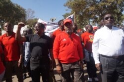 FILE - Opposition leaders Chakwera, left, and Chilima, center, take part in post election protests. (Lameck Masina/VOA)