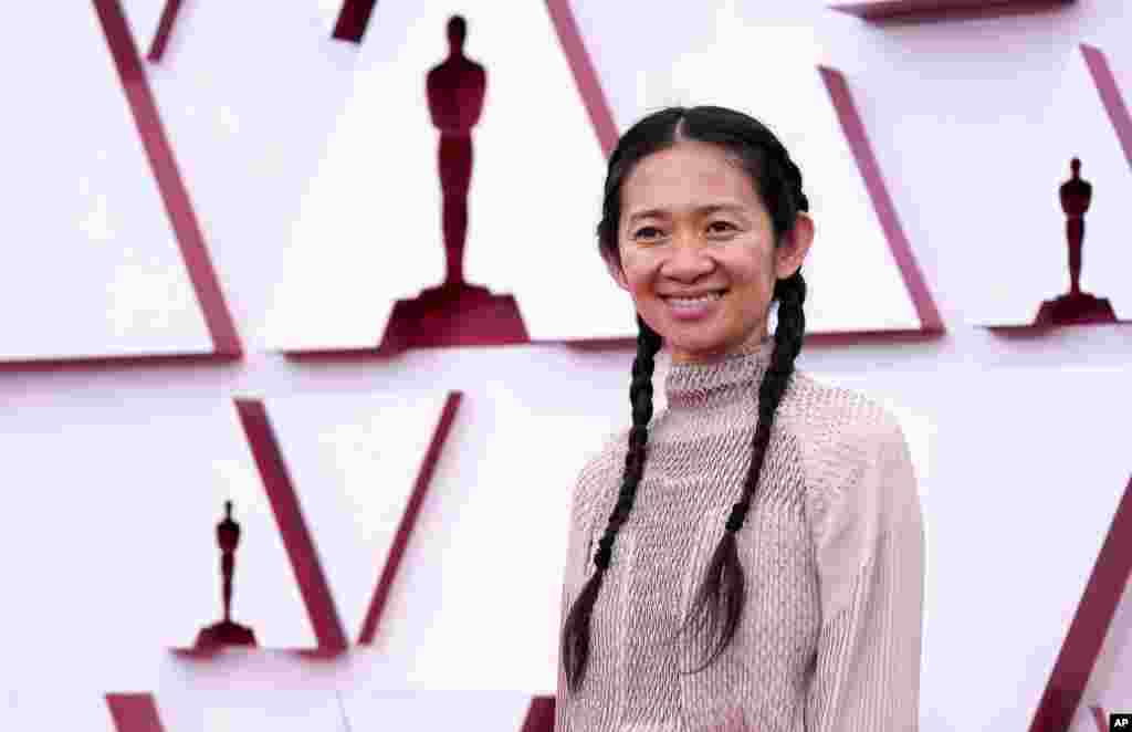 Chloe Zhao arrives at the Oscars on Sunday, April 25, 2021, at Union Station in Los Angeles. (AP Photo/Chris Pizzello, Pool)