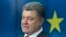 FILE - Ukrainian President Petro Poroshenko speaks during a media conference after a signing ceremony at an EU summit in Brussels, June 27, 2014. 