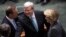 Australian Prime Minister Kevin Rudd (C) greets members of the Opposition including Opposition Leader Tony Abbott (L) and Deputy Leader Julie Bishop before Parliament starts at the Parliament House in Canberra, June 27, 2013. 