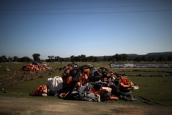 A pile of life jackets is seen in the spot where the government planned to build a new migrant detention center, in the area of Karava on the island of Lesbos, Greece, Feb. 17, 2020.