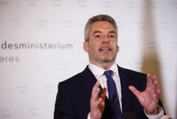 Austria's Interior Minister Karl Nehammer speaks during a news conference at the Interior Ministry after a terrorist attack in Vienna, Nov. 3, 2020.