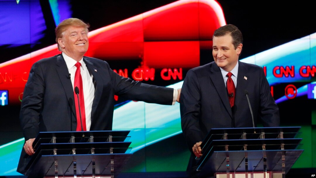 Donald Trump, left, jokes with Ted Cruz during the CNN Republican presidential debate at the Venetian Hotel & Casino on Tuesday, Dec. 15, 2015.