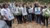 Mourners hold pictures of people killed in an armed gang attack on August 23 during their funeral service, in Kenscoff, Haiti, September 2, 2026. REUTERS/Patrice Noel