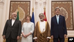 From left, Iranian Foreign Minister Javad Zarif, European Union adviser Catherine Ashton, Omani Minister Responsible for Foreign Affairs Yussef bin Alawi and US Secretary of State John Kerry meet in Muscat, Oman, Nov. 9, 2014. 