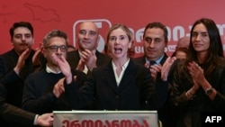 Tina Bokuchava, the seat  of the United National Movement absorption   party, gives a code   during a gathering astatine  the party's office  aft  exit polls were announced during parliamentary elections successful  Tbilisi connected  Oct. 26, 2024.