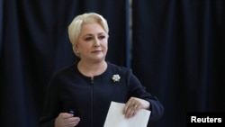 FILE - Romanian Prime Minister Viorica Dancila casts her vote during the European Parliament Elections in Bucharest, May 26, 2019.