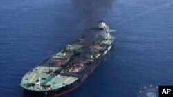 This photo released by the European Union's Operation Aspides naval force shows the Greek-flagged oil tanker Sounion burning in the Red Sea following a series of attacks by Yemen's Houthi rebels on, Sept. 2, 2024.