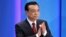 Chinese Premier Li Keqiang claps as he attends the opening ceremony of the Boao Forum for Asia (BFA) Annual Conference 2014 in Boao, Hainan province, April 10, 2014. 