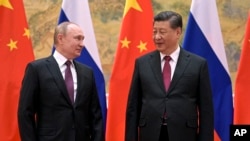 资料照：2022年2月4日，中国国家主席习近平在北京与俄罗斯总统普京举行会晤。