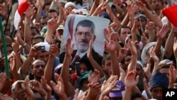 Supporters of ousted Egyptian president Mohammed Morsi protest in Cairo, Egypt, July 9, 2013. 
