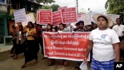 In this image made from video, protesters march in Sittwe, Myanmar, Oct. 22, 2017. Hundreds of hard-line Buddhists protested Sunday to urge Myanmar's government not to repatriate Rohingya Muslims who have fled to Bangladesh since late August to escape violence in Myanmar's Rakhine State. 