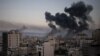 FILE - Smoke rises after Israeli airstrikes on Gaza City, May 12, 2021.