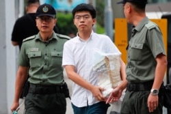 Former student leader Joshua Wong walks out from prison after being jailed for his role in the Occupy Central movement, also known as ìUmbrella Movementî, in Hong Kong, June 17, 2019.