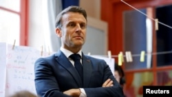 French President Macron visits schools in Paris