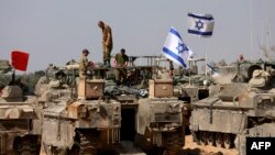 Hêzên Îsraîlê li Kerta Xezayê. (Photo by Menahem KAHANA / AFP)